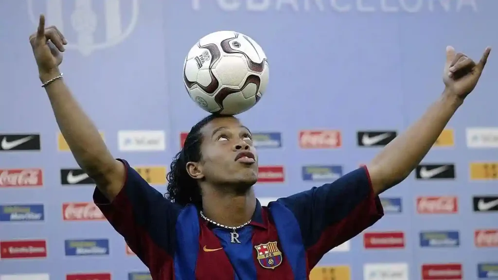 Ronaldinho controlling the ball for Barcelona, representing his unmatched flair in football history.